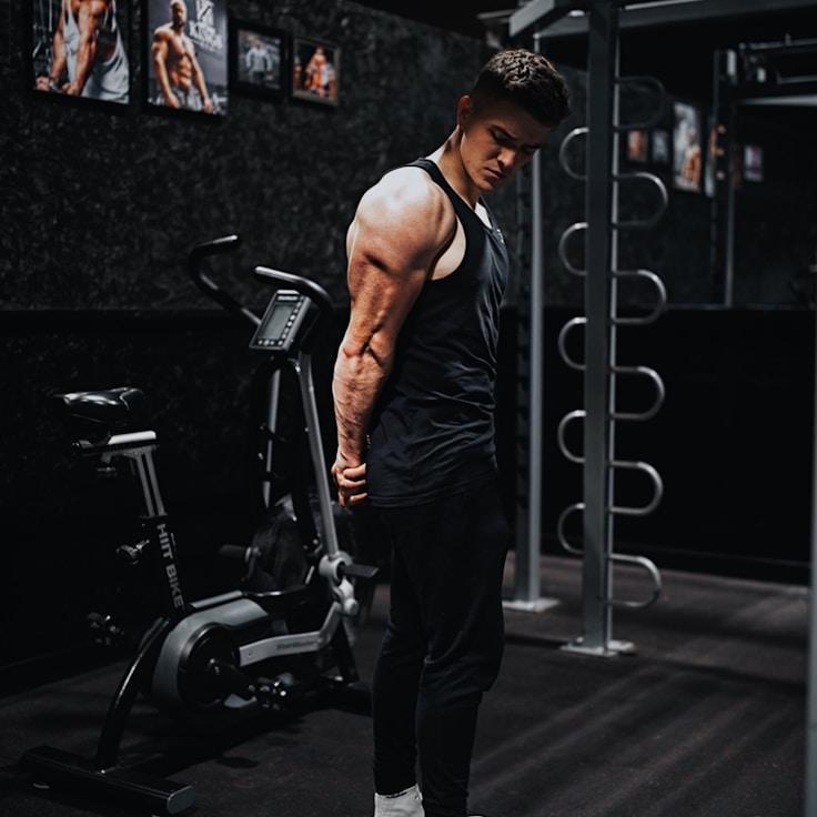 Interior of a professional gym with weight training equipment and mirrors